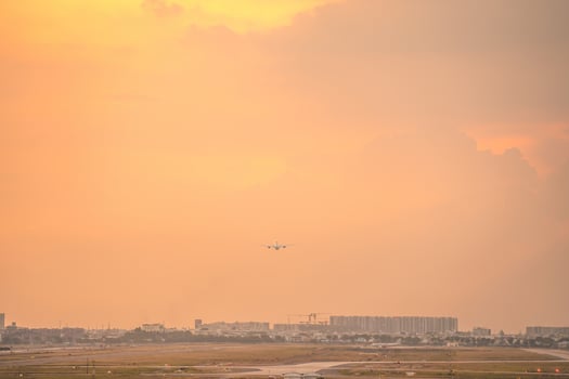 Ho Chi Minh city, Vietnam - FEB 12 2022 Airplane fly over urban areas preparing landing into Tan Son Nhat International Airport and takes off in TSN airport photo