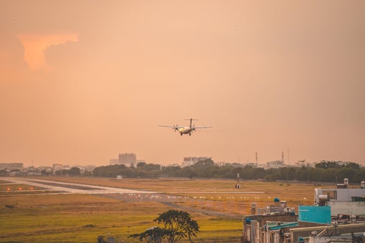 Ho Chi Minh city, Vietnam - FEB 12 2022 Airplane fly over urban areas preparing landing into Tan Son Nhat International Airport and takes off in TSN airport photo