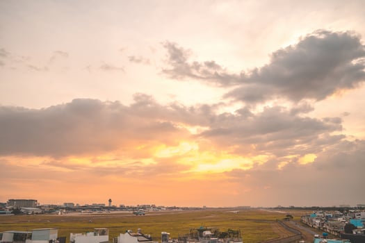 Ho Chi Minh city, Vietnam - FEB 12 2022 Airplane fly over urban areas preparing landing into Tan Son Nhat International Airport and takes off in TSN airport photo
