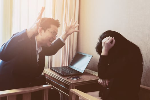 Businessman angrily discussing with his secretary photo