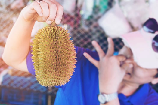Man making durian disgusting expression photo