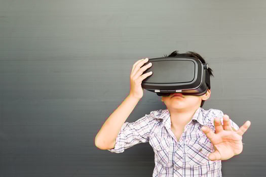 7 years kid playing VR virtual reality game photo