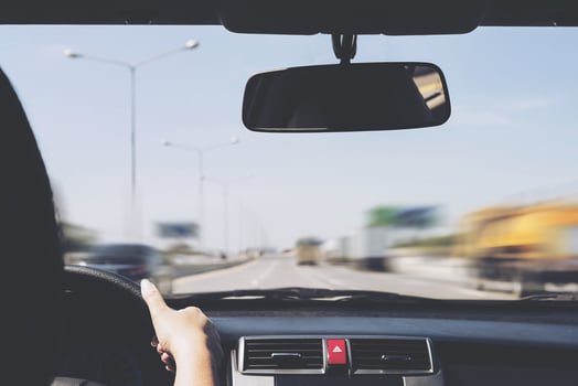 Woman driving car using two hand photo
