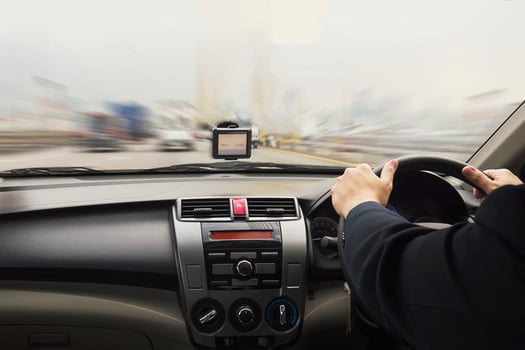 Business man is speedily driving a car photo