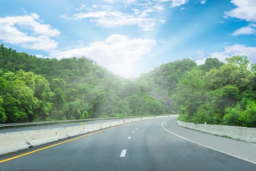 Beautiful highway road of Thailand with green mountain and blue sky background photo