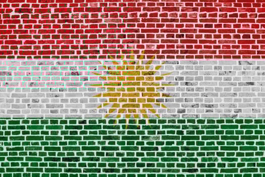 Flag of Kurdistan painted on a brick wall photo