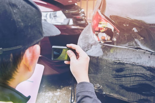 Insurance agent working on car accident claim process photo