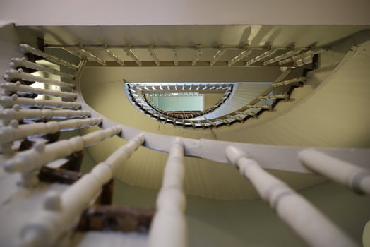 Old and Spiral stairs inside a building photo