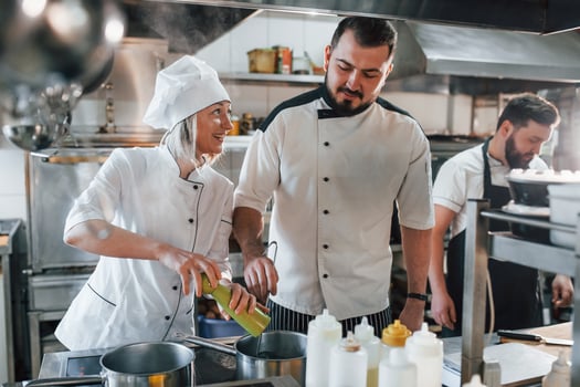 Professional chef preparing food in the kitchen photo