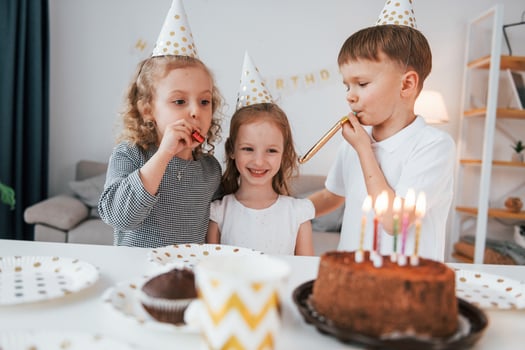Celebrating brithday. Group of children is together at home at daytime photo