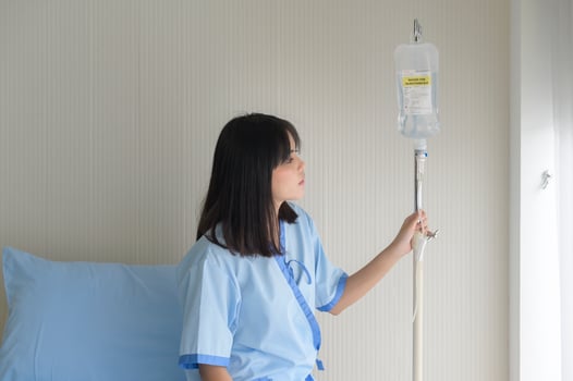 Hopeful and happy young patient woman in hospital, healthcare and medical concept photo