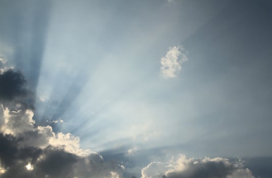 Dramatic sky with sun beam photo