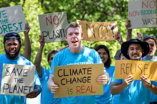 Diversity group of volunteer activist demonstrating in protest for global warming and climate change project with written placard for environmental awareness and reducing plastic consumption concept photo
