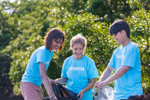 Team of young and diversity volunteer worker group enjoy charitable social work outdoor in cleaning up project in the countryside photo
