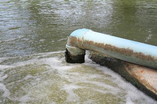Waste water flow from water pipe photo