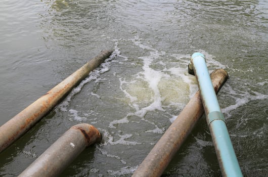 Waste water flow from water pipe photo