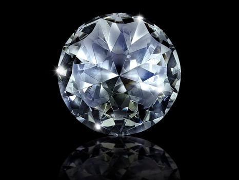 Dazzling diamond on black background photo