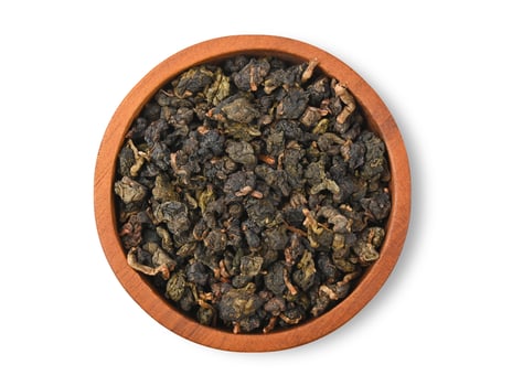 Chinese oolong tea Tie GuanYin isolated on white background. Top view photo