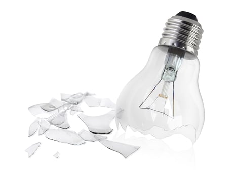 Broken light bulb isolated on white background photo
