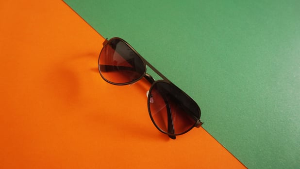 Sunglasses isolated color and light background photo