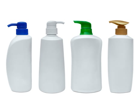 blank shampoo bottle on white isolated background photo