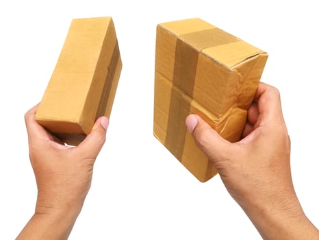 hand holding brown paper box package isolated on white background photo