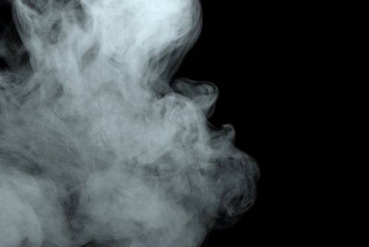 Abstract powder or smoke effect isolated on black background photo