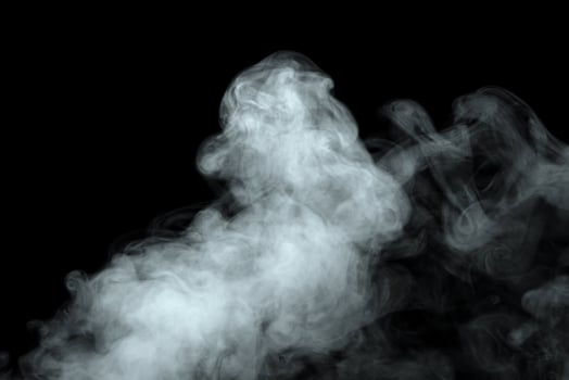 Abstract powder or smoke effect isolated on black background photo