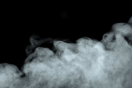 Abstract powder or smoke effect isolated on black background photo