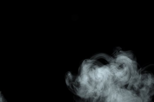 Abstract powder or smoke effect isolated on black background photo