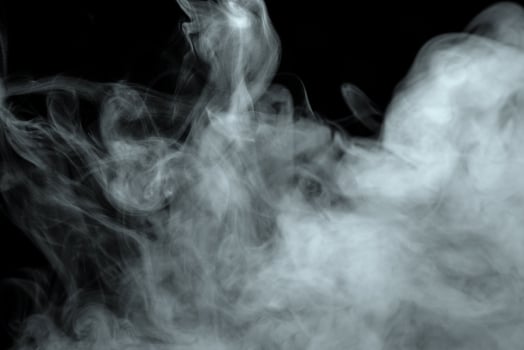 Abstract powder or smoke effect isolated on black background photo