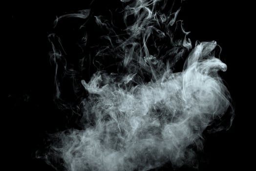 Abstract powder or smoke effect isolated on black background photo