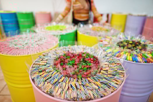 Barrels with sweets in candy shop. photo