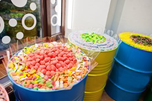 Barrels with sweets in candy shop. photo