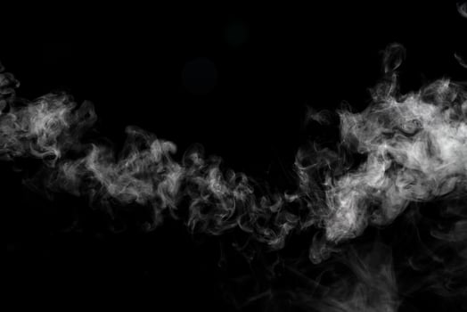 Abstract powder or smoke isolated on black background photo