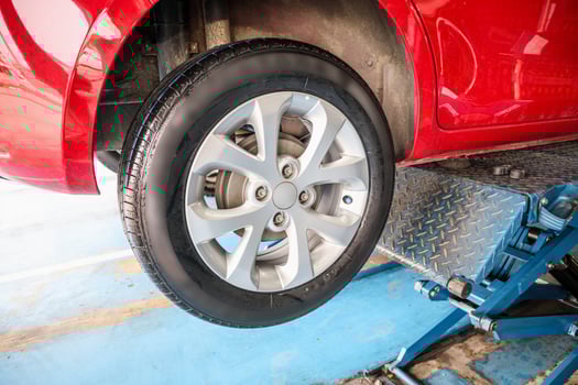 auto tire replacement at car service centre repair shop photo