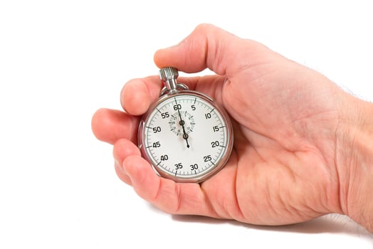 Hand holding stopwatch photo