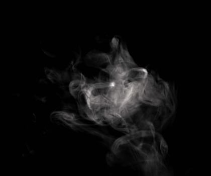 Abstract powder or smoke isolated on black background photo
