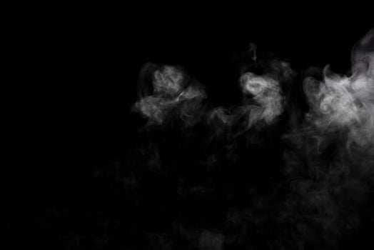 Abstract powder or smoke isolated on black background photo