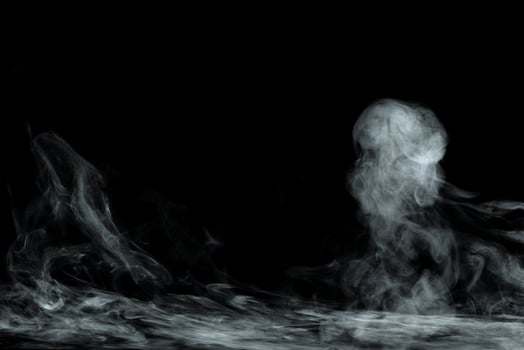 Abstract powder or smoke isolated on black background photo