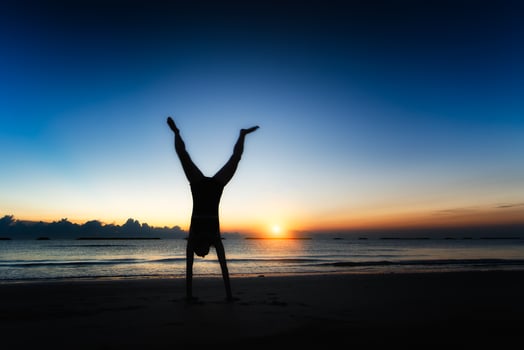 physical exercise at sunset on the sea photo