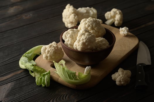 Raw, fresh organic cauliflower on a wooden background. Healthy eating, low carb diet concept photo