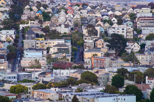 Golden hour neighborhood hill view of San Francisco homes, peaked roofs - colorful and scenic with some Victorian homes - a typical San Francisco view. photo
