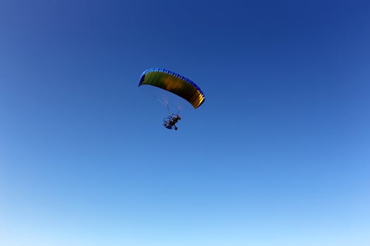 A paraglider flies over the Mediterranean Sea in northern Israel photo