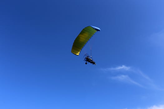 A paraglider flies over the Mediterranean Sea in northern Israel photo