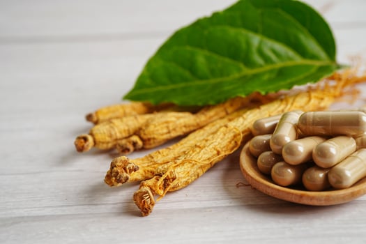 Ginseng roots and green leaf, healthy food. photo