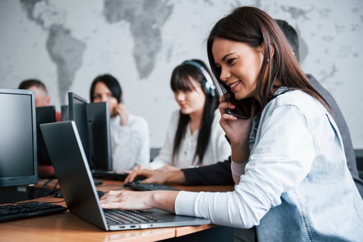 Young people working in the call center. New deals is coming photo