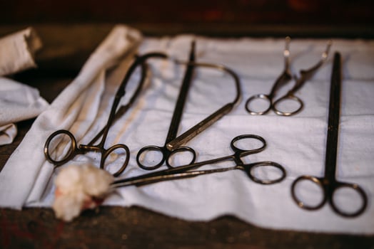 Surgical instruments for medical operation on a wooden table. photo
