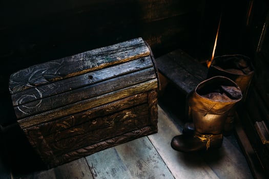 Wooden winch of a sailing ship and ropes on the deck of medieval pirate warship photo