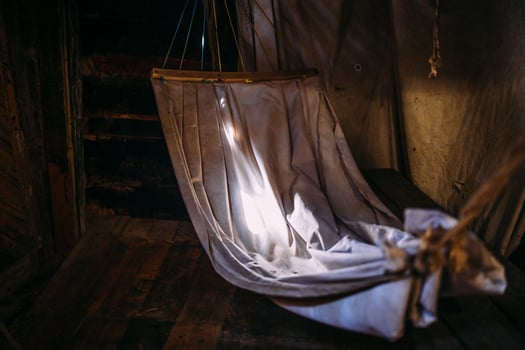 Wooden winch of a sailing ship and ropes on the deck of medieval pirate warship photo
